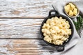 American mac and cheese, macaroni pasta in cheesy sauce. White wooden background. Top view. Copy space Royalty Free Stock Photo