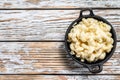 American mac and cheese, macaroni pasta in cheesy sauce. White wooden background. Top view. Copy space Royalty Free Stock Photo