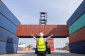 American man Foreman control loading containers box to truck for logistics export  of International global shipping Royalty Free Stock Photo