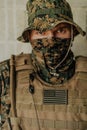 American marine corps special operations soldier preparing tactical and commpunication gear for action battle closeup