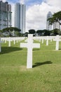 The American Memorial Cemetery with buildings in background, Manila, Philippines Royalty Free Stock Photo
