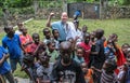 American missionary doctor has some fun with local children in rural Haiti.