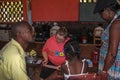 American missionary nurse meets with Haitian woman and girl assisted