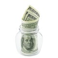 American money hundred dollar bill in glass jar isolated on white background clipping path. Pile US 100 banknote Royalty Free Stock Photo