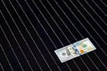 American money on solar panel surface. Renewable energy cost Royalty Free Stock Photo