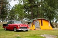 American muscle car Chevrolet BelAir in a camp with a retro tent in Halden, Norway