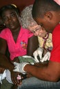 American nurse examins child during medical mission to rural Haiti.