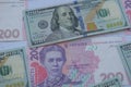 American one hundred dollars banknote and ukrainian hryvnas
