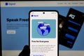 American open-source, encrypted messaging service Signal app on mobile app in front of desktop version