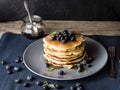 American pancake stack with blueberry topping