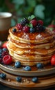 American pancakes for breakfast in the morning on wooden table with fresh berries honey cream maple syrup and coffee Royalty Free Stock Photo