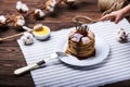 American pancakes on a plate with mint and child hand