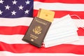 American passport with vaccination record on a flag Royalty Free Stock Photo