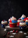 American patriotic cupcakes with cherries and stars on dark background. generated ai Royalty Free Stock Photo