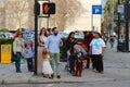 American pedestrians stopped at a traffic light