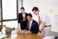 American people business team having using laptop during a meeting. Royalty Free Stock Photo