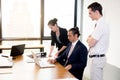 American people business team having using laptop during a meeting. Royalty Free Stock Photo