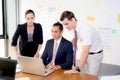 American people business team having using laptop during a meeting and presents. Royalty Free Stock Photo