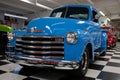 American pickup truck from the 50s, it is a blue Chevrolet Advance Design