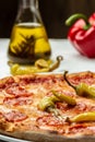 American pizza with pepperoni, mozzarella and tomato sauce. Tasty italian pizza made from an authentic recipe. Food recipe Royalty Free Stock Photo