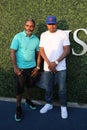 American rapper Nas (R) attends US Open 2015 tennis match between Serena and Venus Williams Royalty Free Stock Photo