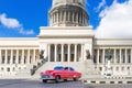 American red 1952 classic car on the street Paseo de Marti in before the Capitolio in Havana City Cuba - Serie Cuba Royalty Free Stock Photo