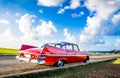 American red 1959 vintage car parked on the fortress el Morro near the beach in Havana Cuba - Serie Cuba Reportage Royalty Free Stock Photo