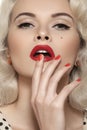 American retro. Fashion pin-up model, lips make-up, red nails Royalty Free Stock Photo