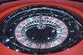 American roulette table, gambling. Roulette wheel spinning clockwise rotation, tourelle