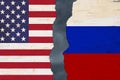 American and Russian flags that are torn apart