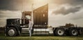 American Semi Truck Driver Next to His Tractor Truck