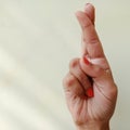 american sign language alphabet letter Q displayed with isolated hand on light background Royalty Free Stock Photo