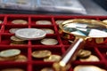 American silver dollar and magnifying glass