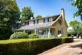 American single-story house. Traditional American-style home with beautiful landscaping