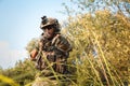 American soldier aiming rifle and pointing at you