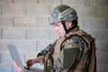 Soldier using laptop computer Royalty Free Stock Photo