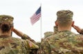 American Soldiers Saluting US Flag Royalty Free Stock Photo