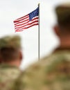 American Soldiers and US Flag. US troops Royalty Free Stock Photo