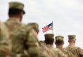 American Soldiers and US Flag. US troops Royalty Free Stock Photo