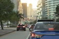 American street with driving cars at intersection with traffic lights in Miami, Florida. USA transportation Royalty Free Stock Photo