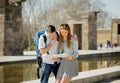 American student and tourist couple reading city map in tourism concept Royalty Free Stock Photo