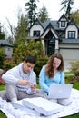 picnic laptop phone american students sit on white blanket on grass picnic pizza sit in laptop and phone order online Royalty Free Stock Photo