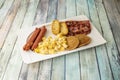 American-style breakfast with pancakes, scrambled eggs, muffins, pork sausage, Royalty Free Stock Photo