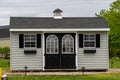 american style wooden shed exterior view door window new store style Royalty Free Stock Photo