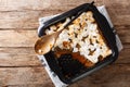 American sweet potato casserole with marshmallows close-up in a baking dish. Horizontal top view
