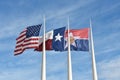 American, Texas and City of Dallas Flags blowing in the Wind Royalty Free Stock Photo