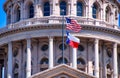 American and Texas state flags flying on the dome of the Texas State Capitol building in Austin Royalty Free Stock Photo