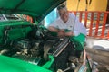 American tourist with 1952 Chevrolet engine