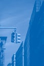 American traffic light and skyscrapers, fragment. Gradient classic blue color, toned Royalty Free Stock Photo