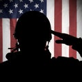 American (USA) soldier saluting to USA flag Royalty Free Stock Photo